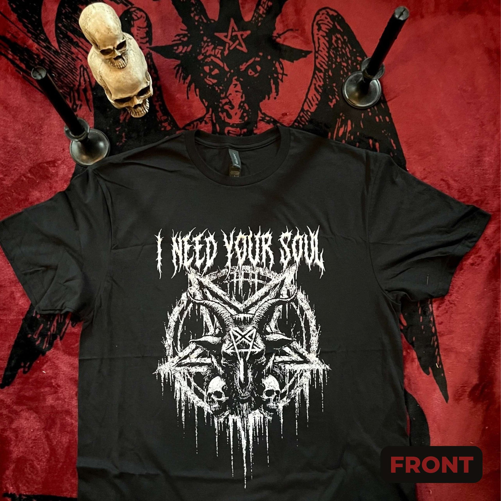Front of T-shirt shows "I need your soul" in gothic white print with an inverted pentagram and goat head at the center.